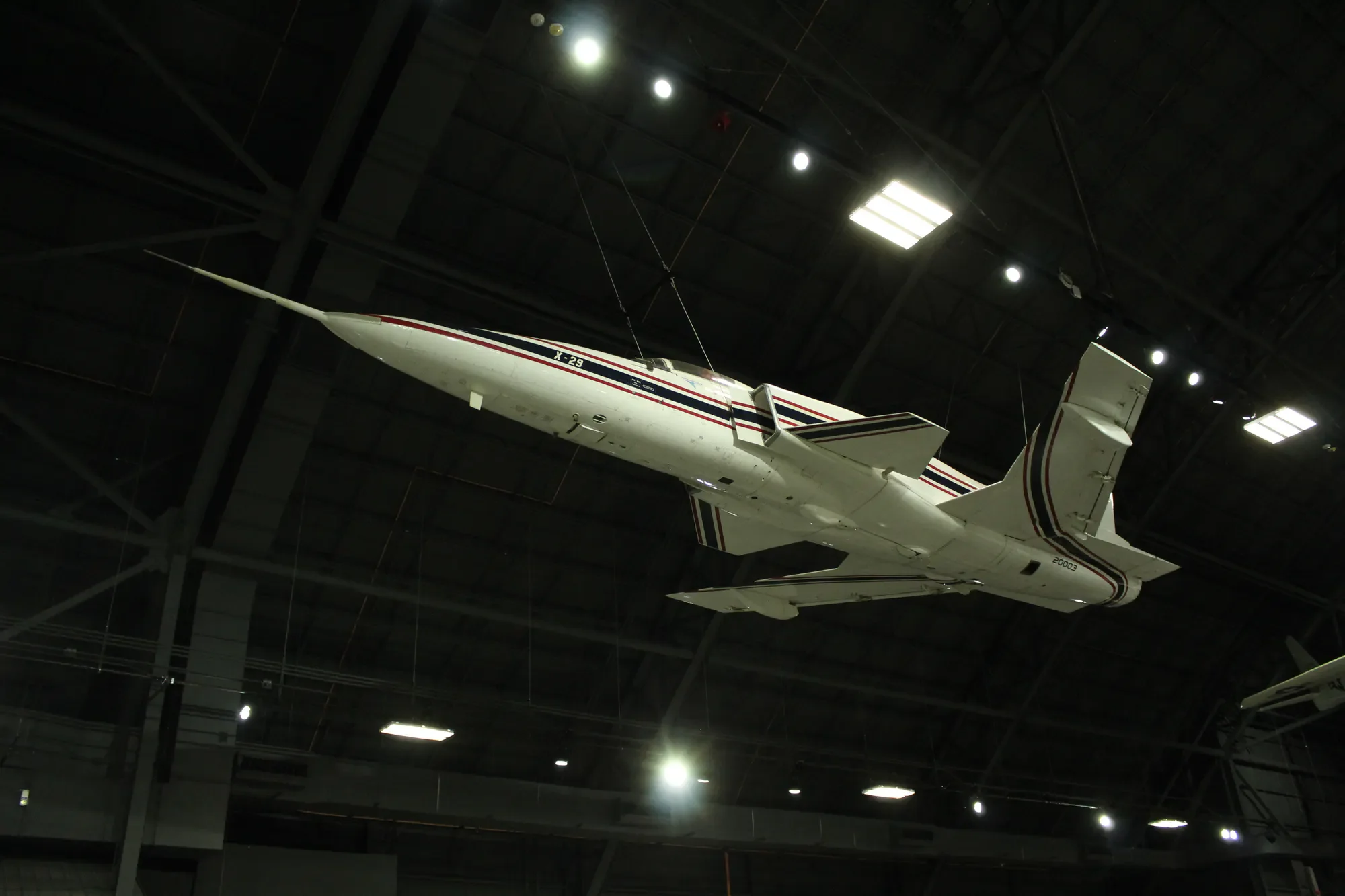 X-29 experimental aircraft suspended inside a museum hangar