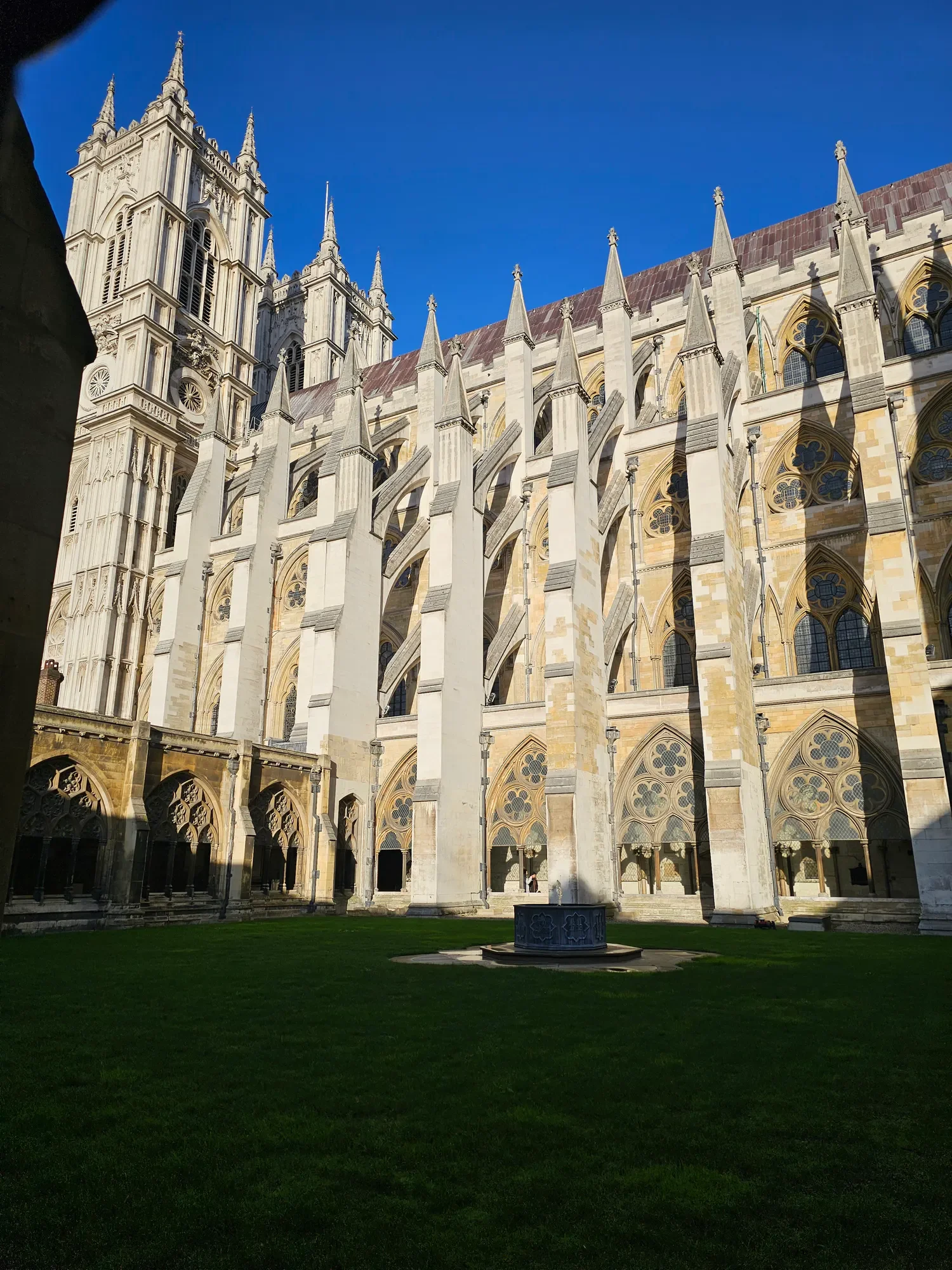 Historic stone courtyard and lawn at Westminster