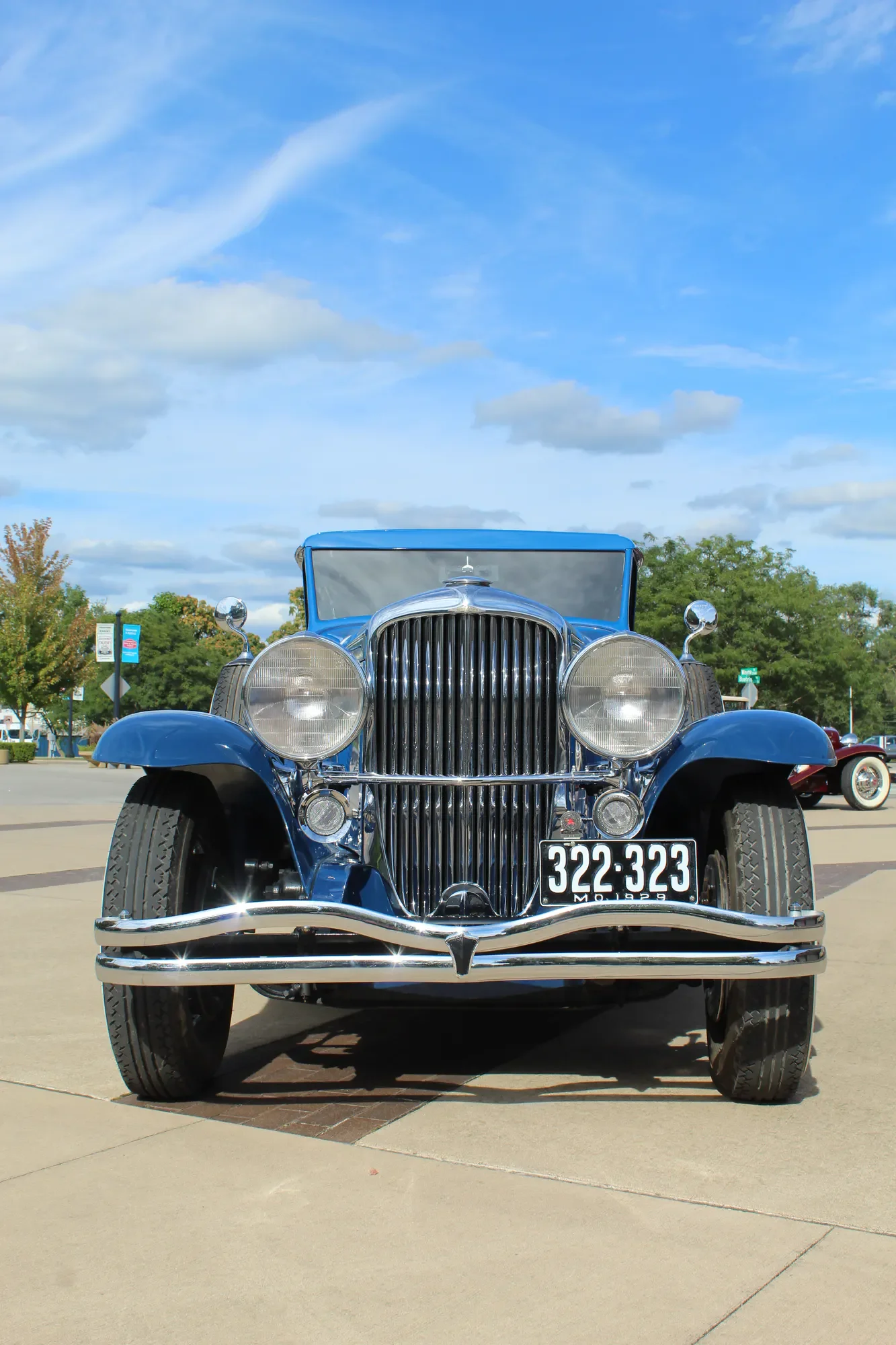 Blue Duesenberg Model J Murphy Clear Vision Sedan photographed head-on at a collector-car gathering