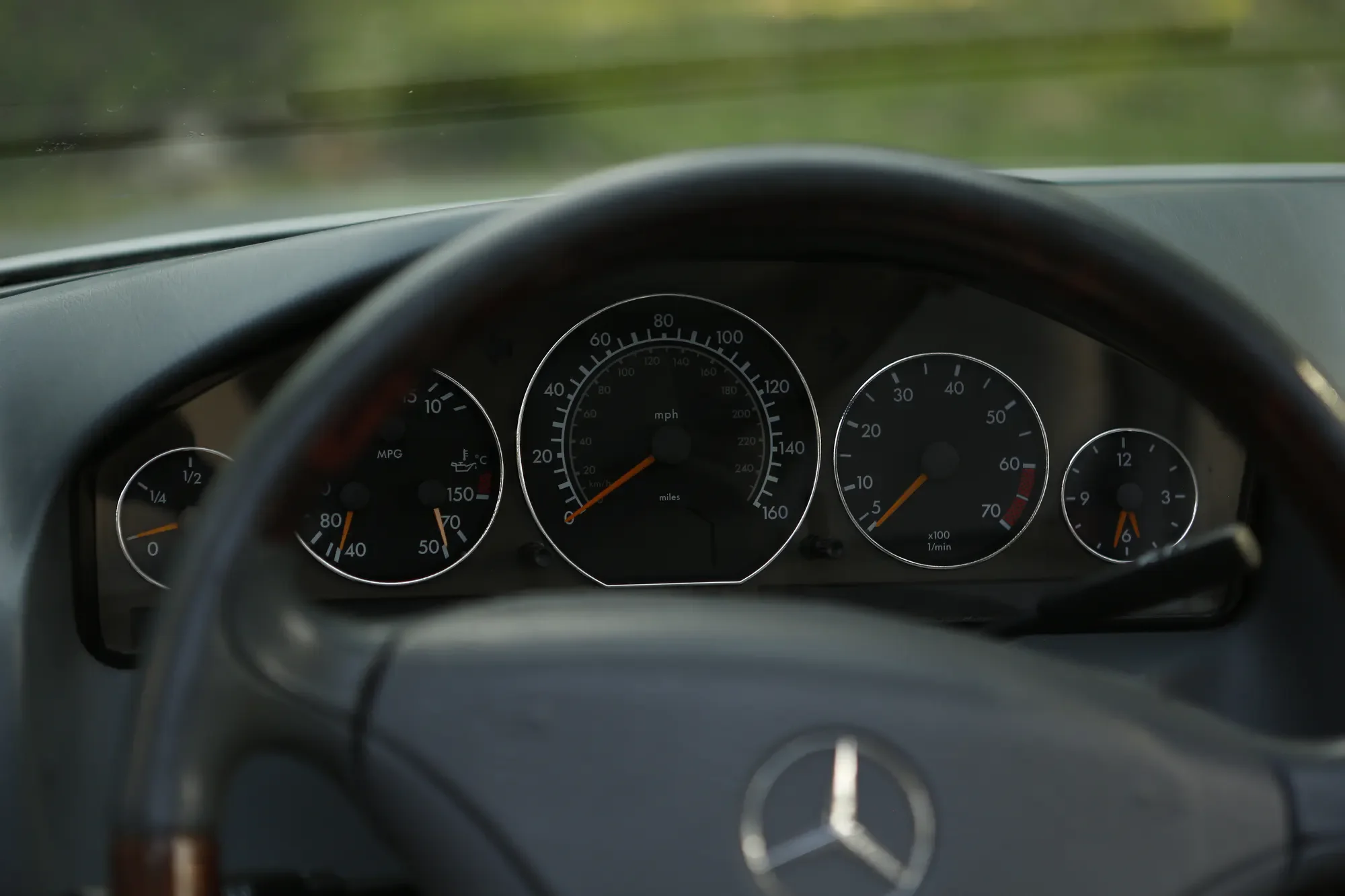 Instrument cluster viewed over the steering wheel of a Mercedes-Benz SL500