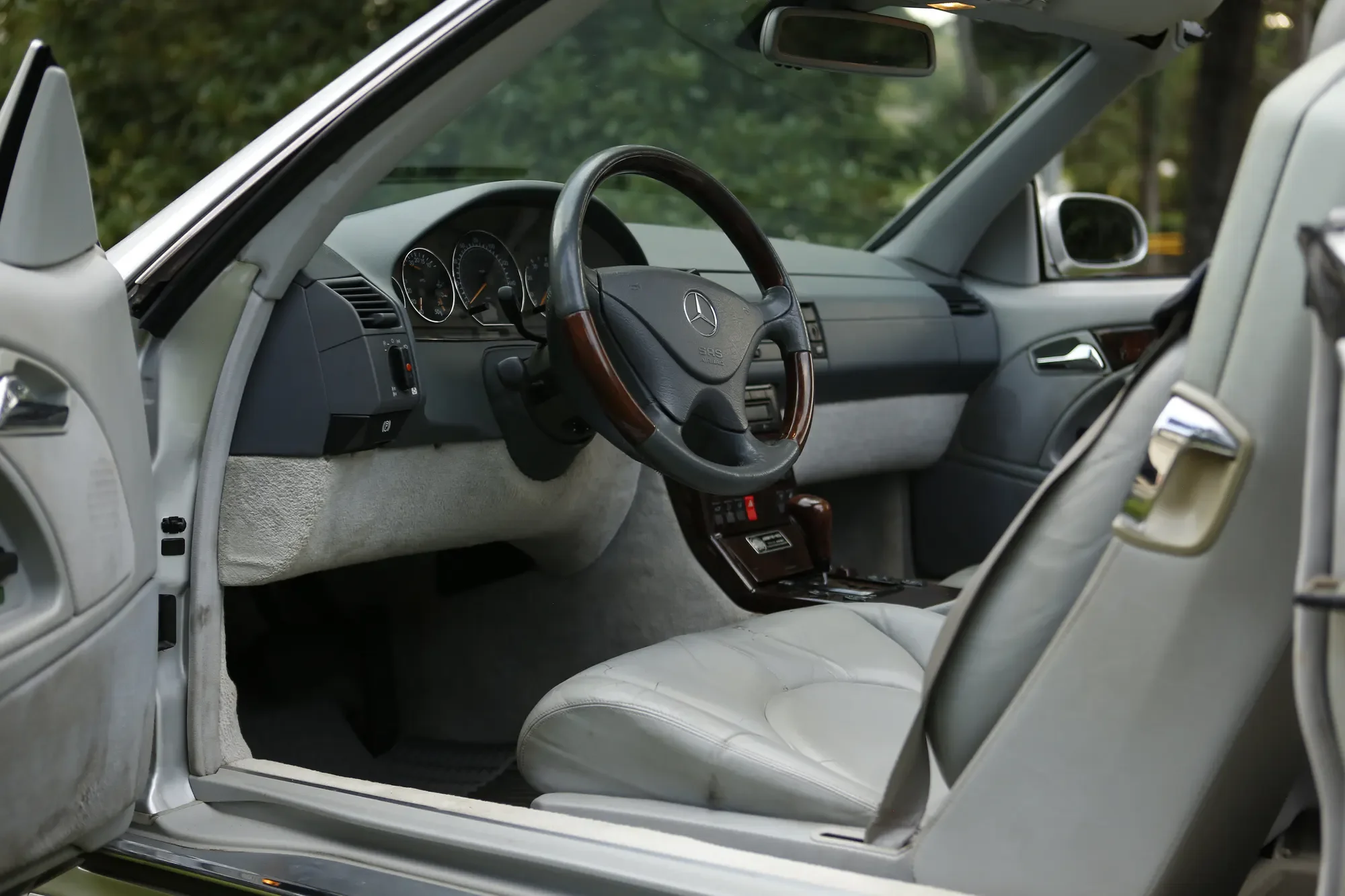 Open door revealing the interior of a Mercedes-Benz SL500
