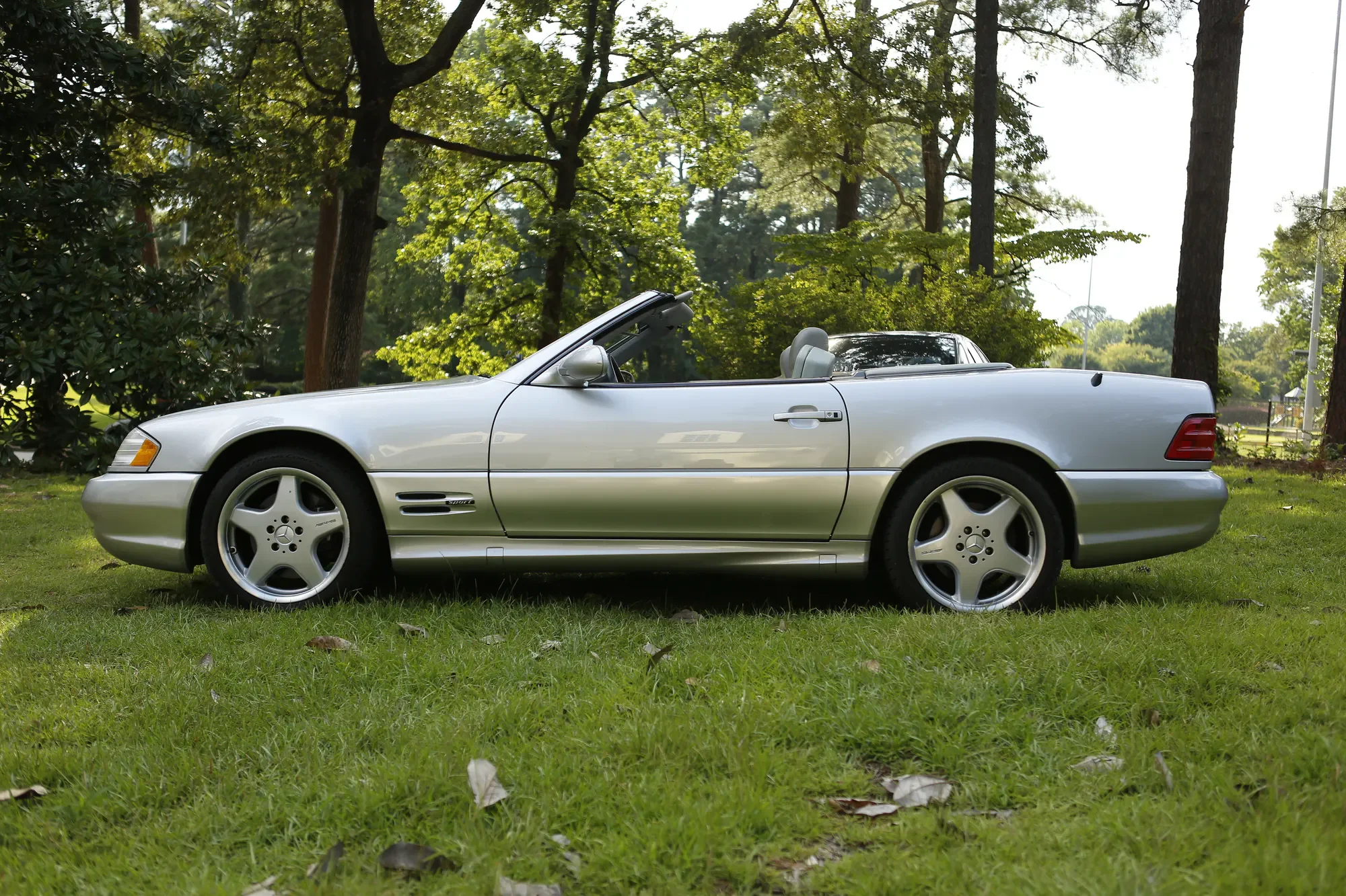 Silver Mercedes-Benz SL500 photographed in full side profile
